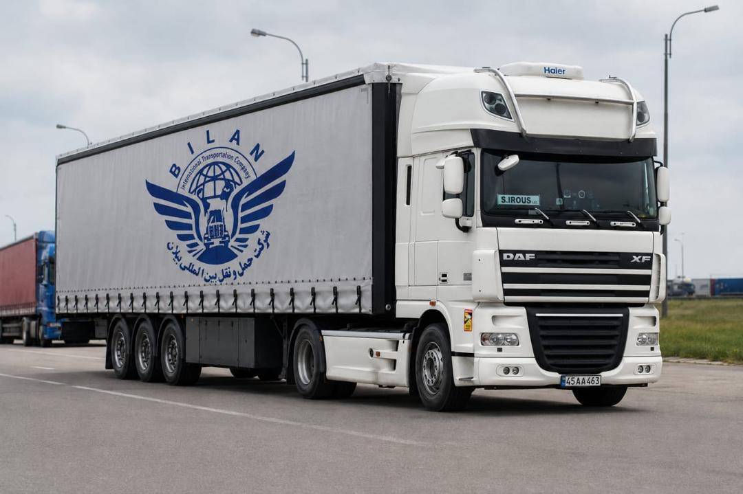 Bilan partner tautliner truck operating on an international road route